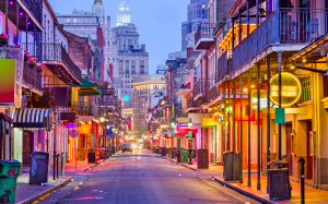 A street with many buildings and lights on it