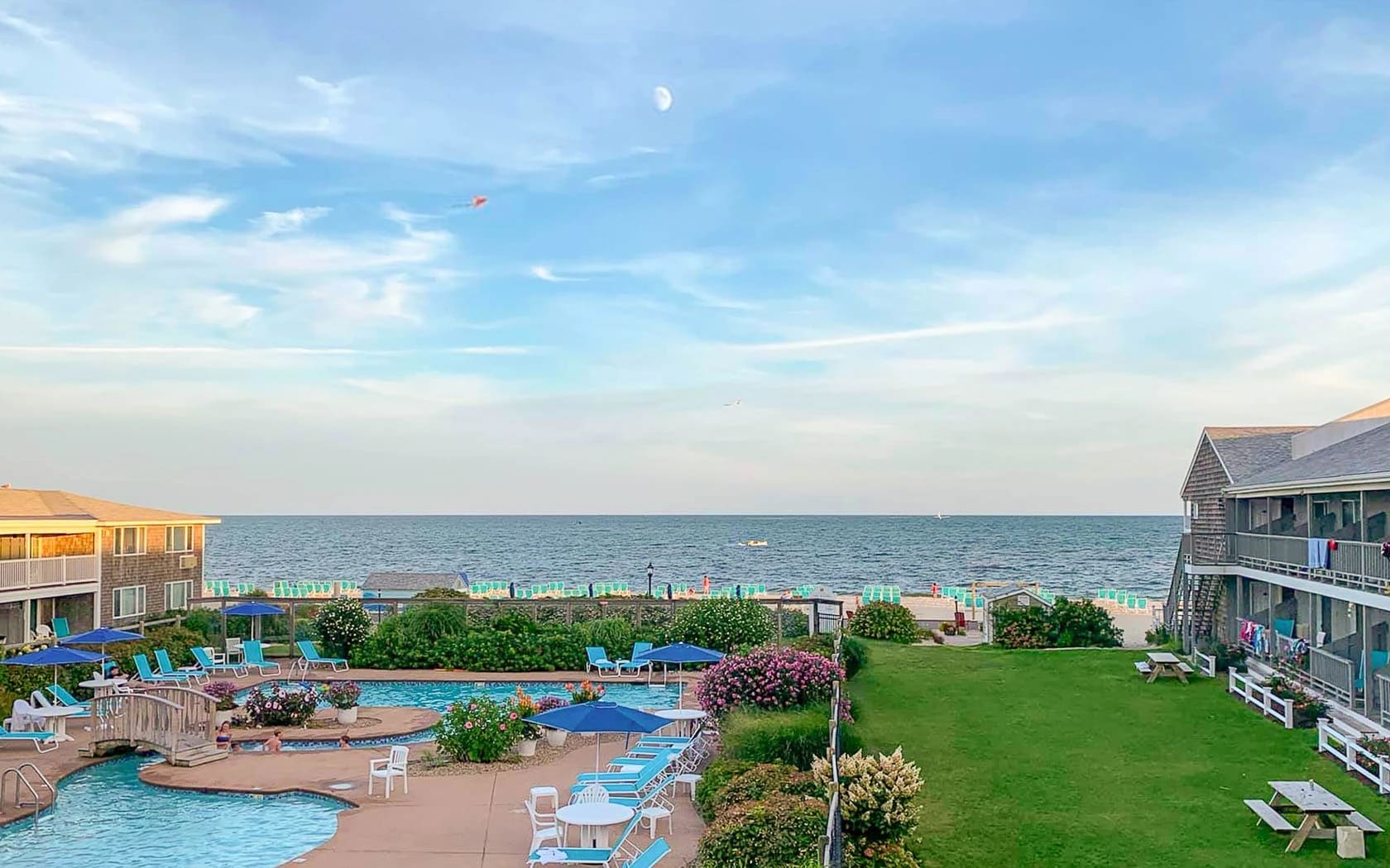 A view of the ocean from an outdoor pool.