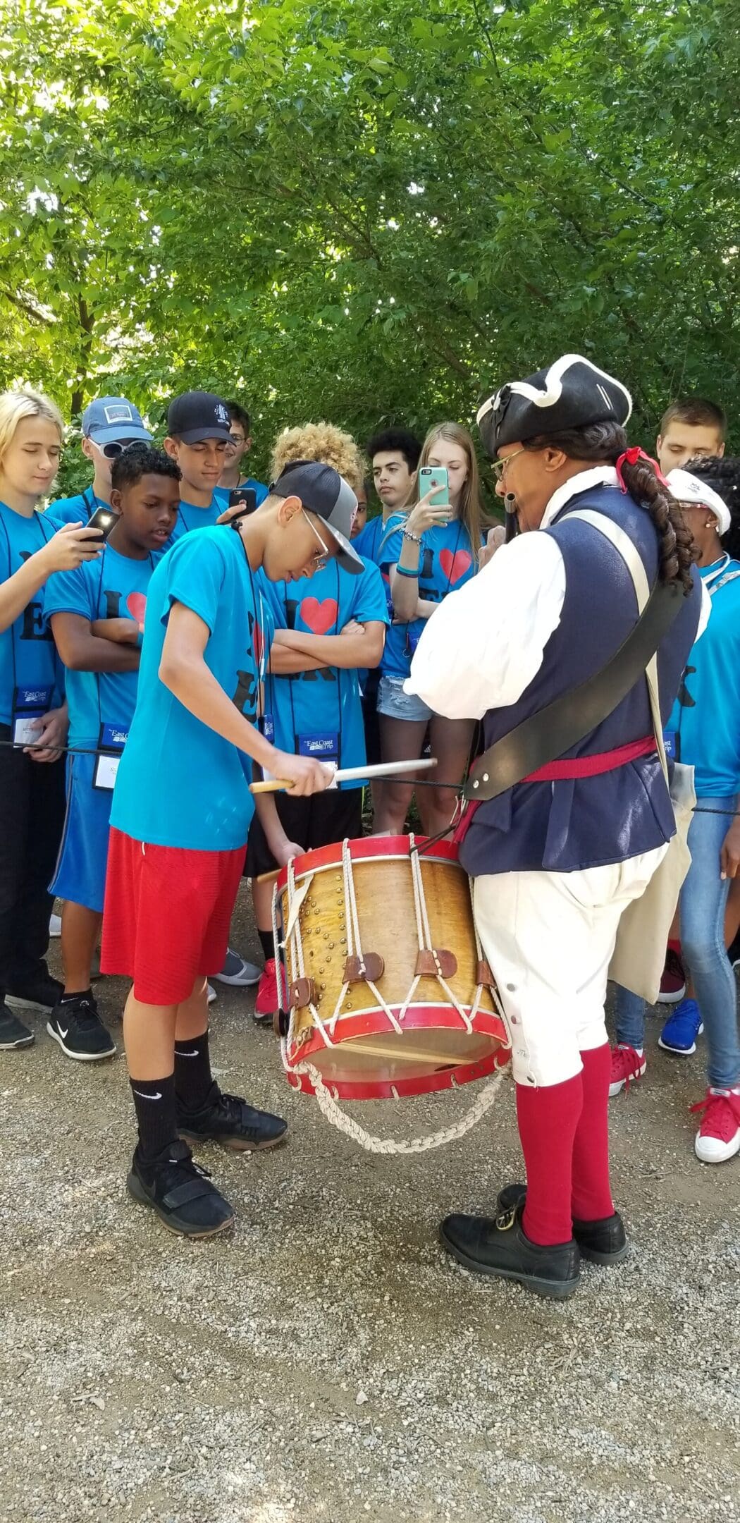 A group of people standing around each other.