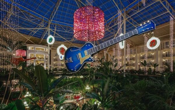 Giant guitar Christmas display in atrium.